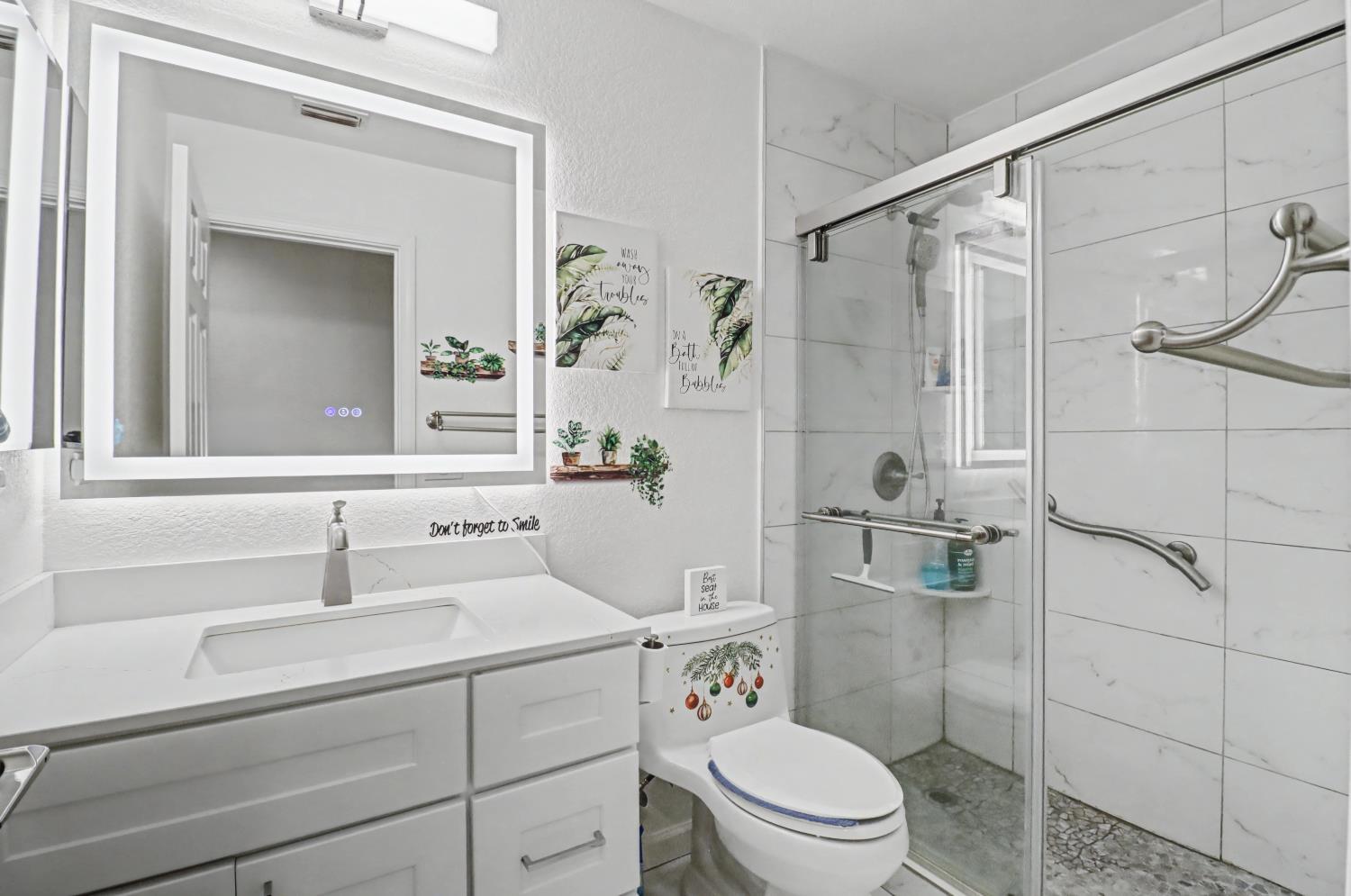 10056 Wexted Way Elk Grove, CA 95757 - Photo 29 of 39 a bathroom with a sink toilet and shower