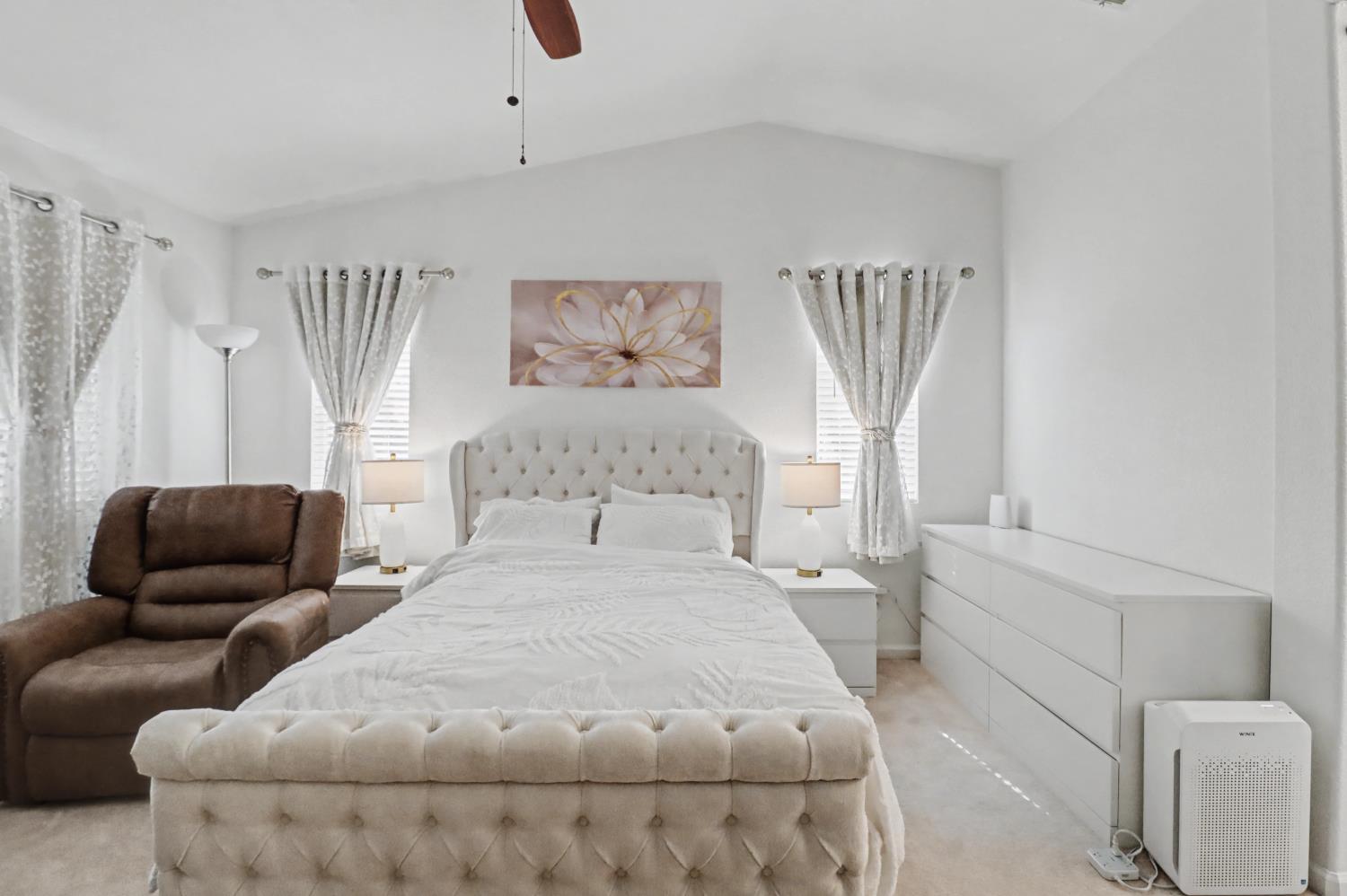 10056 Wexted Way Elk Grove, CA 95757 - Photo 31 of 39 a bedroom with a bed and a couch