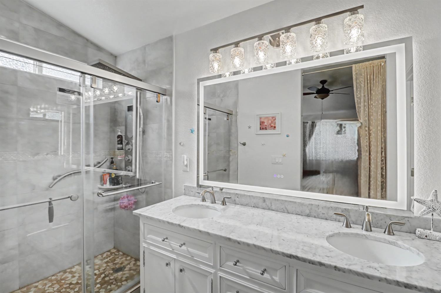 10056 Wexted Way Elk Grove, CA 95757 - Photo 34 of 39 a bathroom with a granite countertop sink mirror and double