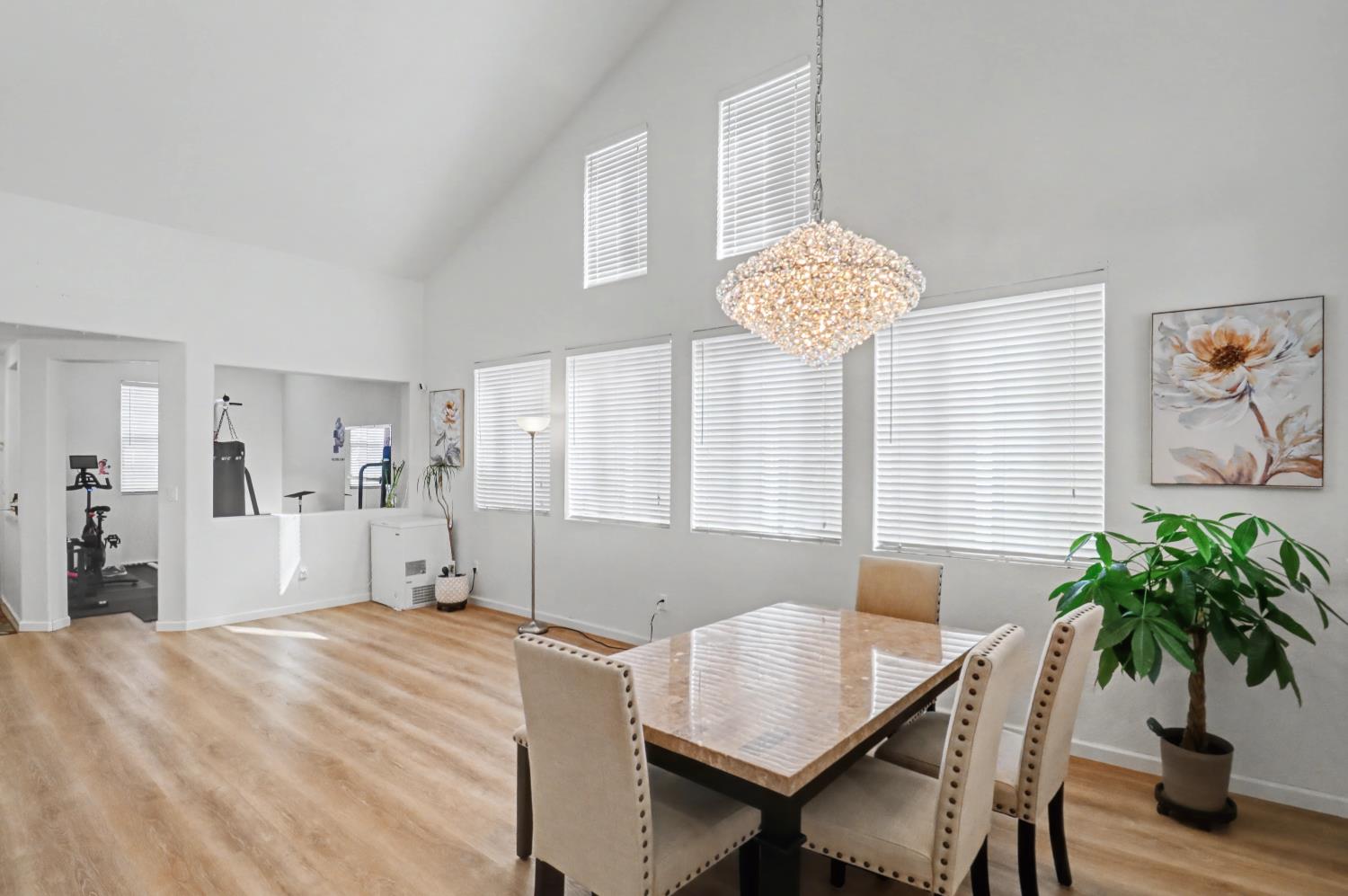 10056 Wexted Way Elk Grove, CA 95757 - Photo 8 of 39 a bed room with a bed and a chandelier