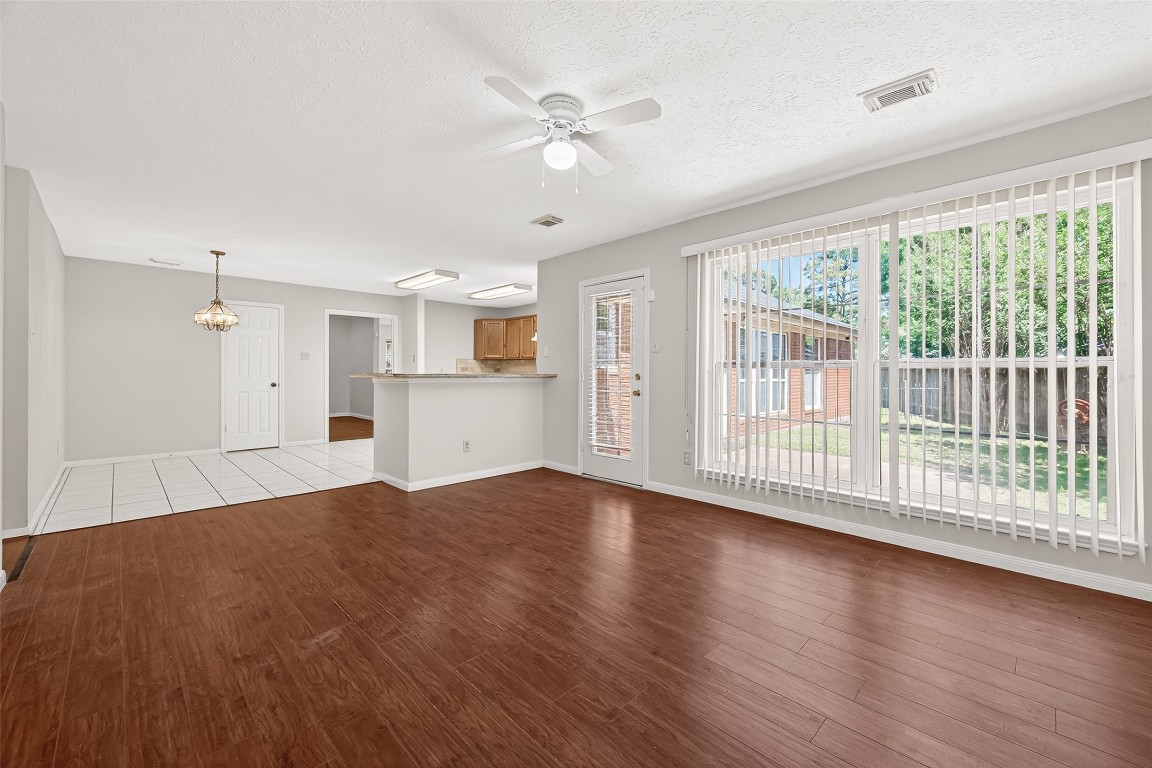 3506 Doherty Place Katy, TX 77449 - Photo 23 of 50 a view of empty room with wooden floor and fan