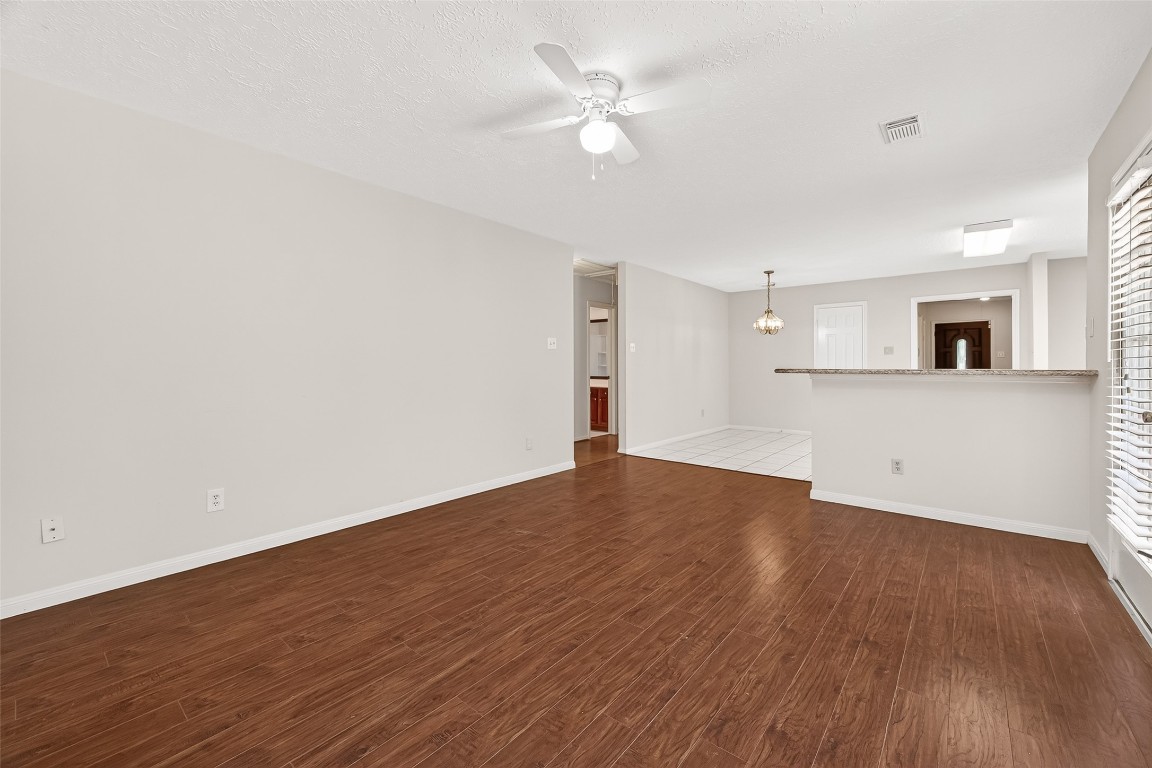 3506 Doherty Place Katy, TX 77449 - Photo 24 of 50 an empty room with wooden floor and a ceiling fan