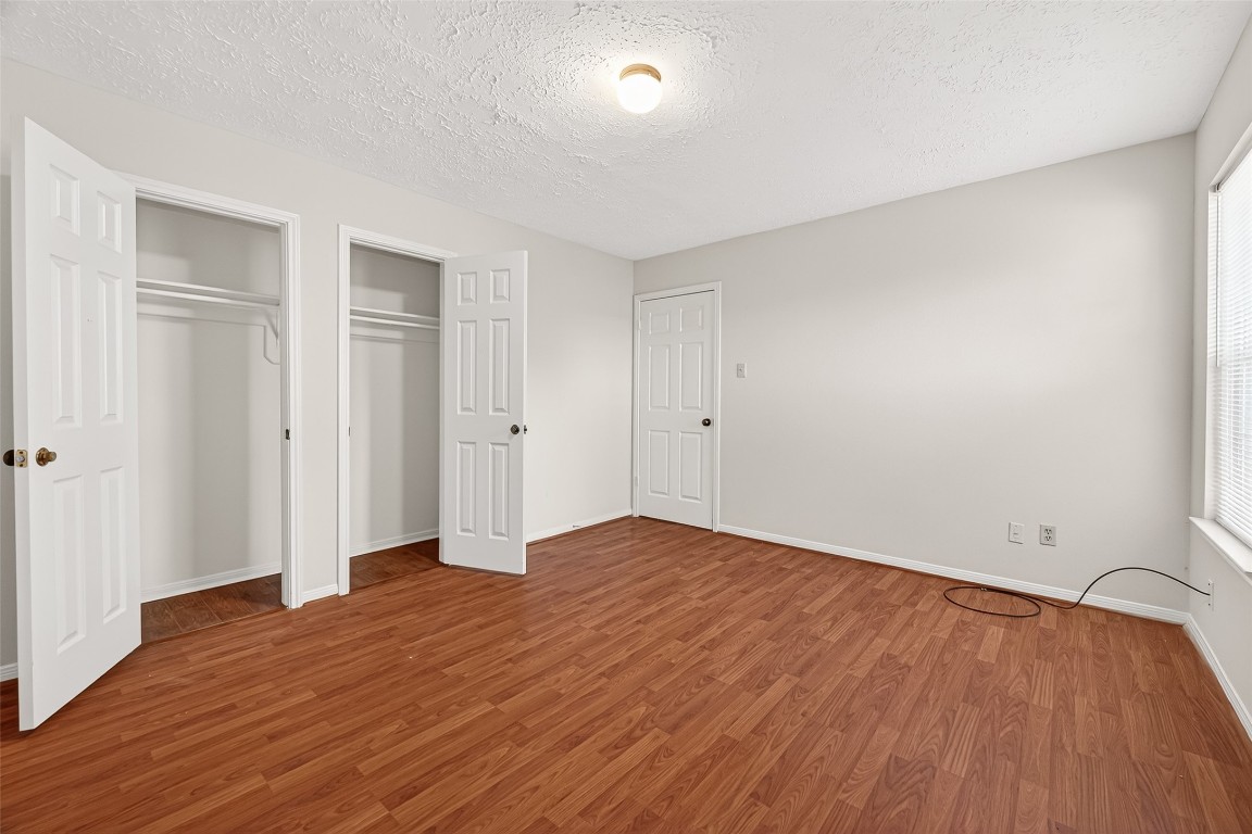 3506 Doherty Place Katy, TX 77449 - Photo 27 of 50 a view of empty room with wooden floor and entryway