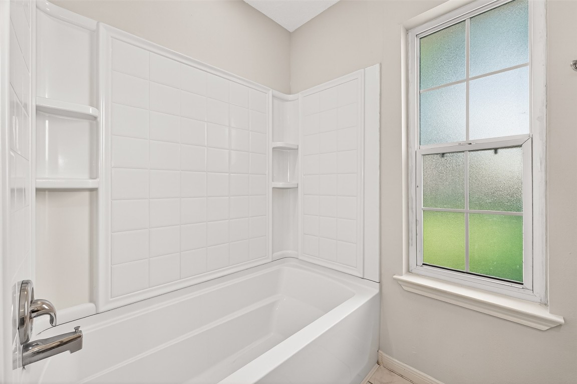 3506 Doherty Place Katy, TX 77449 - Photo 30 of 50 a bathroom with a tub and shower