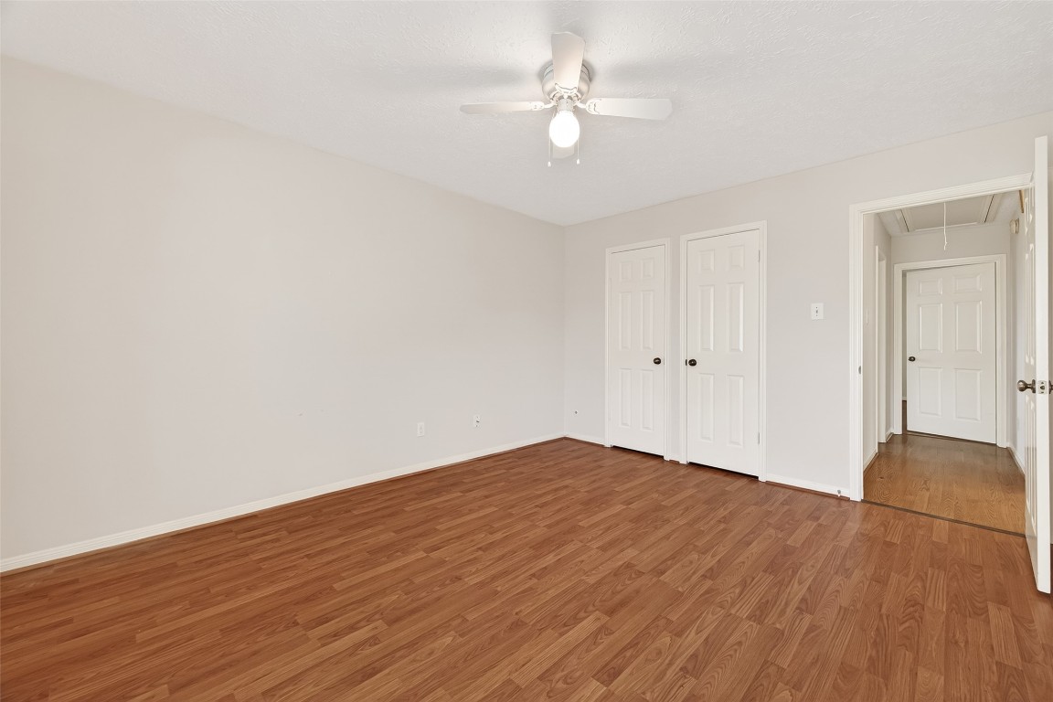 3506 Doherty Place Katy, TX 77449 - Photo 33 of 50 an empty room with wooden floor and fan