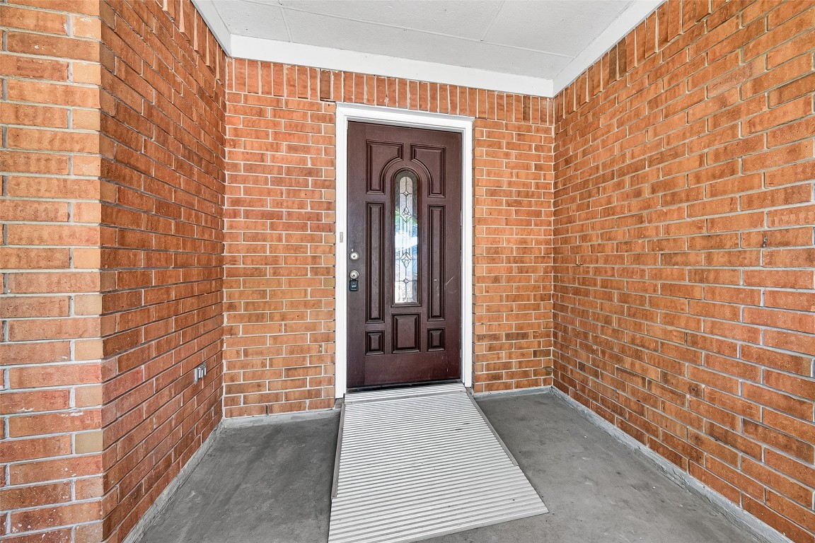 3506 Doherty Place Katy, TX 77449 - Photo 4 of 50 a view of a brick house with a large window
