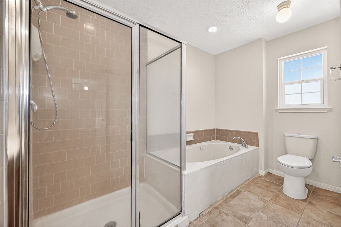 3506 Doherty Place Katy, TX 77449 - Photo 41 of 50 a bathroom with a shower a toilet and a bathtub