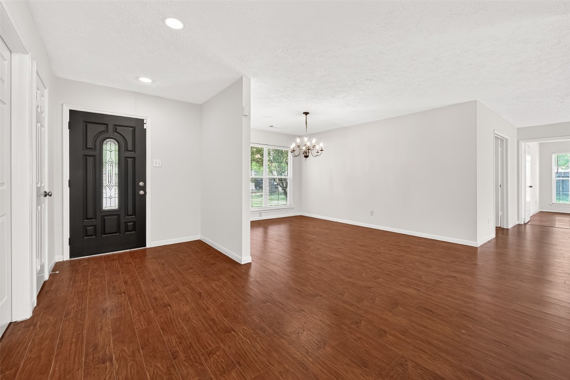 3506 Doherty Place Katy, TX 77449 - Photo 5 of 50 an empty room with wooden floor and windows