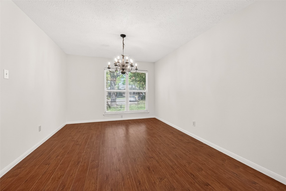 3506 Doherty Place Katy, TX 77449 - Photo 6 of 50 a view of a big room with wooden floor and chandelier
