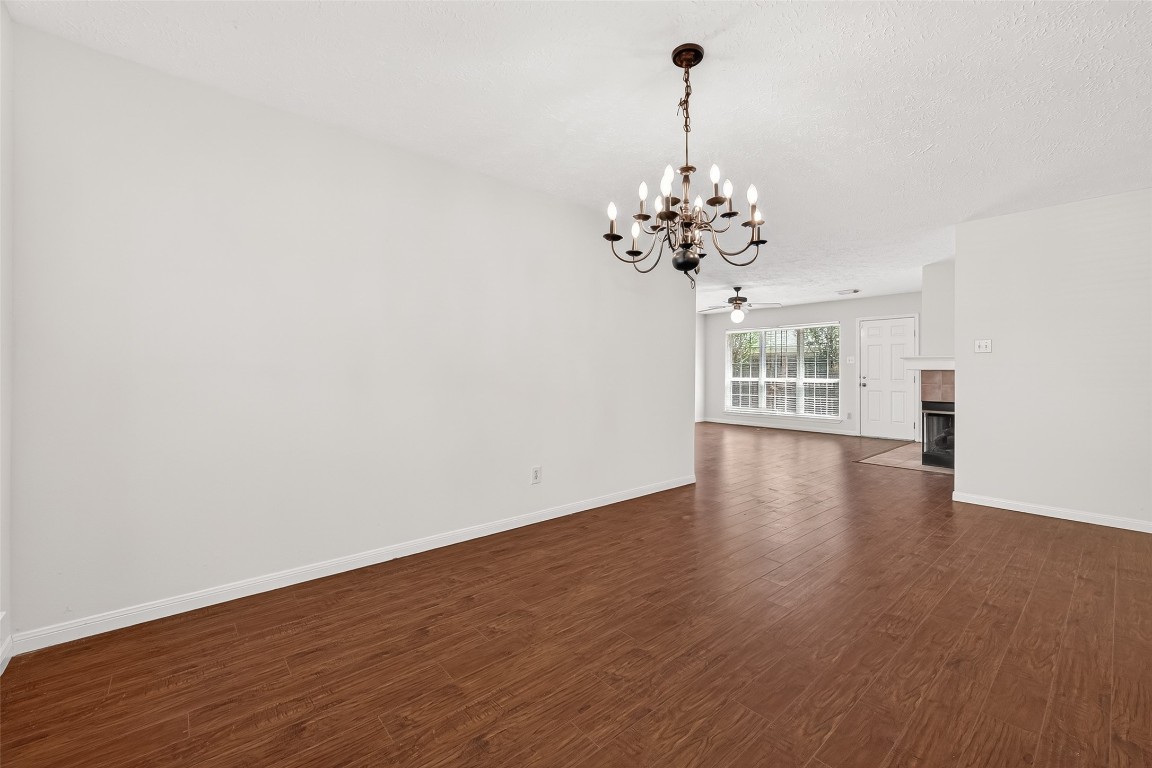 3506 Doherty Place Katy, TX 77449 - Photo 9 of 50 a view of a room with wooden floor chandelier and a window