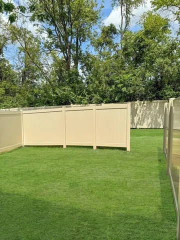 a view of yard with swimming pool