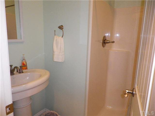524 Fred Parrish Road Castalia, NC 27816 - Photo 14 of 20 Bath across the hall from the laundry room and access from the double garage