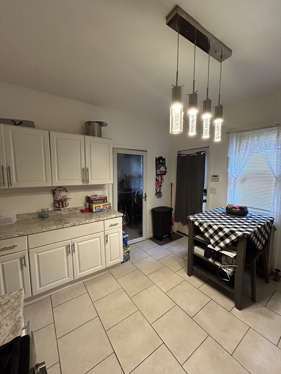 830-832 Carew Street Springfield, MA 01104 - Photo 3 of 27 a kitchen with stainless steel appliances a stove a sink and cabinets