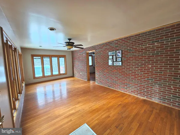 a large kitchen with stainless steel appliances granite countertop a stove a sink and a refrigerator
