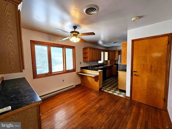 a view of a room with a flat screen tv