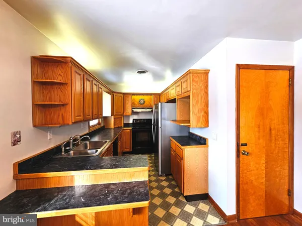 a view of a hallway with wooden shelves