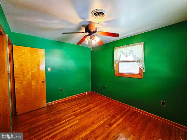 a view of a room with a furniture and a window