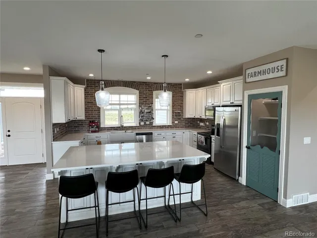 a view of a livingroom from a hallway