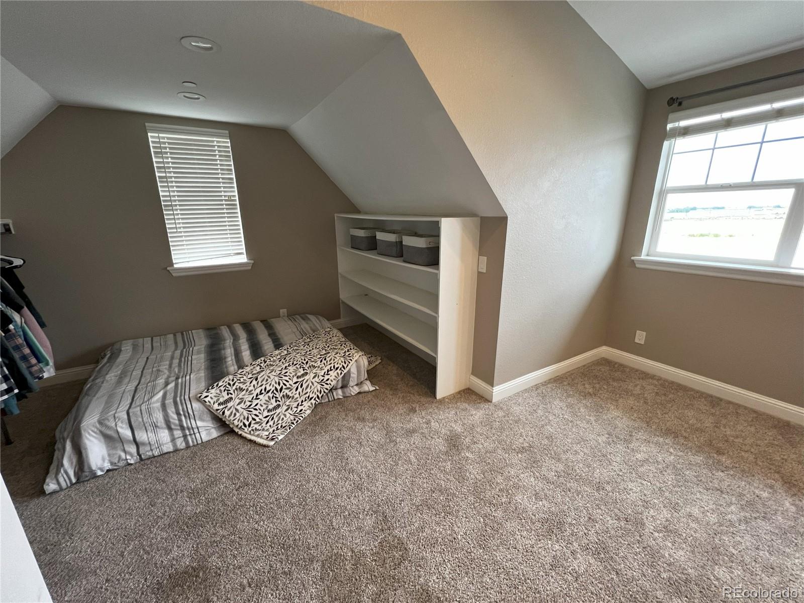 6945 Strasburg Road Strasburg, CO 80136 - Photo 32 of 42 a living room with furniture and a window
