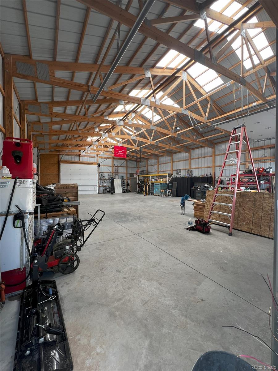 6945 Strasburg Road Strasburg, CO 80136 - Photo 35 of 42 a view of a storage room with a lot of stuff
