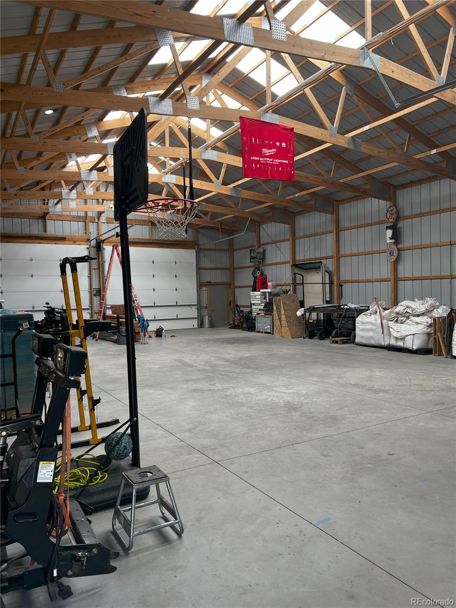 6945 Strasburg Road Strasburg, CO 80136 - Photo 36 of 42 a view of a room with gym equipment