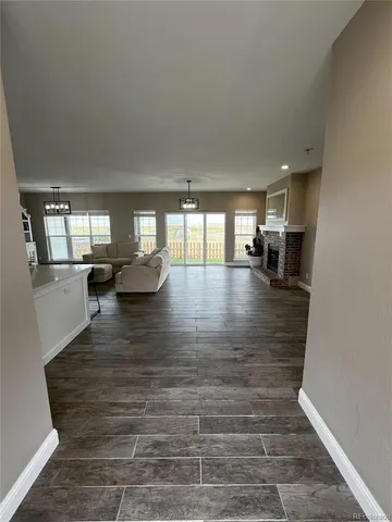 a lobby with furniture and floor to ceiling window