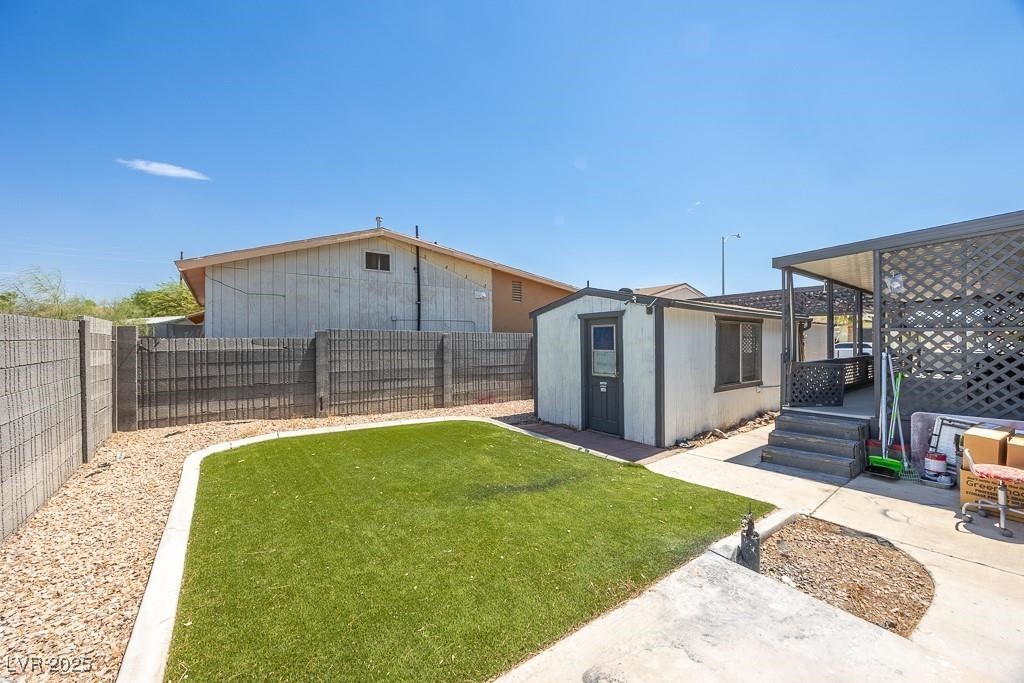 1208 Inca Lane Henderson, NV 89015 - Photo 6 of 21 Fenced backyard featuring an outbuilding
