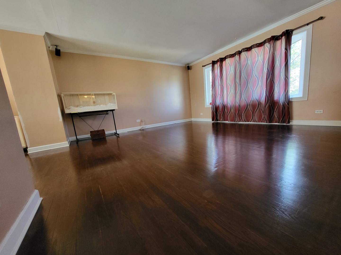 1770 Chippendale Road Hoffman Estates, IL 60169 - Photo 16 of 25 a view of a room with wooden floor and a window