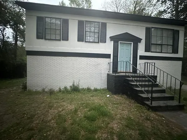front view of a house with a yard