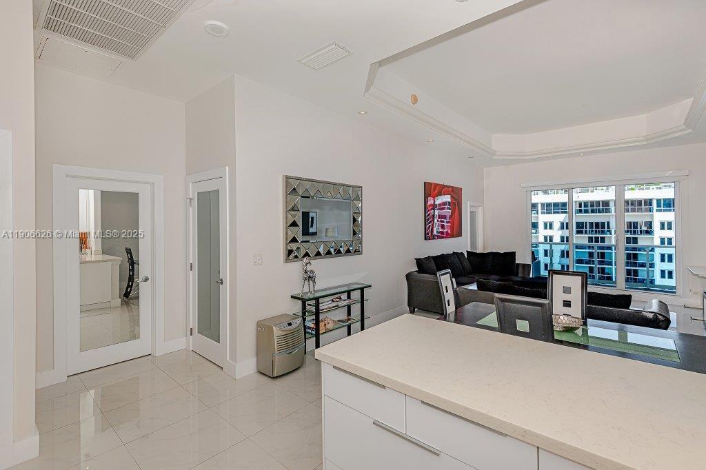 2301 Collins Avenue, Unit 1619 Miami Beach, FL 33139 - Photo 4 of 28 a view of kitchen with furniture and large window
