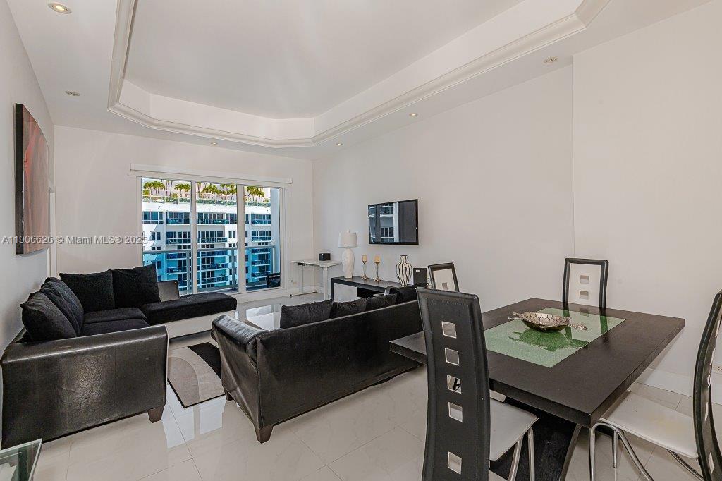 2301 Collins Avenue, Unit 1619 Miami Beach, FL 33139 - Photo 5 of 28 a living room with furniture and a window