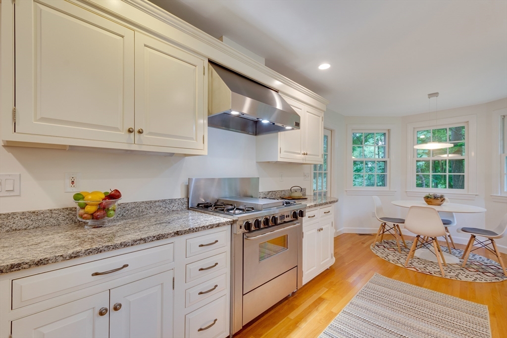 24 Beaver Pond Road Lincoln, MA 01773 - Photo 14 of 35 a kitchen with stainless steel appliances granite countertop a stove a sink and white cabinets
