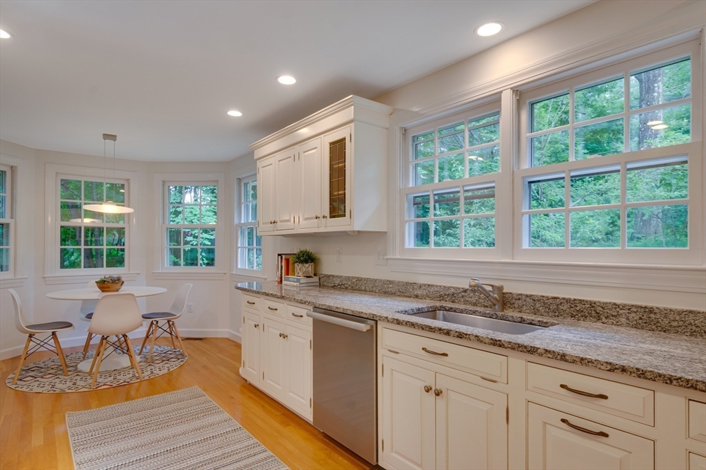 24 Beaver Pond Road Lincoln, MA 01773 - Photo 16 of 35 a kitchen with a sink a window and cabinets