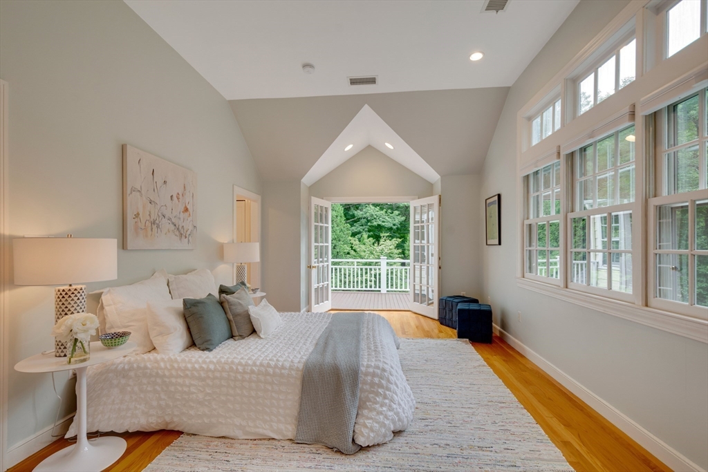 24 Beaver Pond Road Lincoln, MA 01773 - Photo 17 of 35 a bed room with a bed and a large window