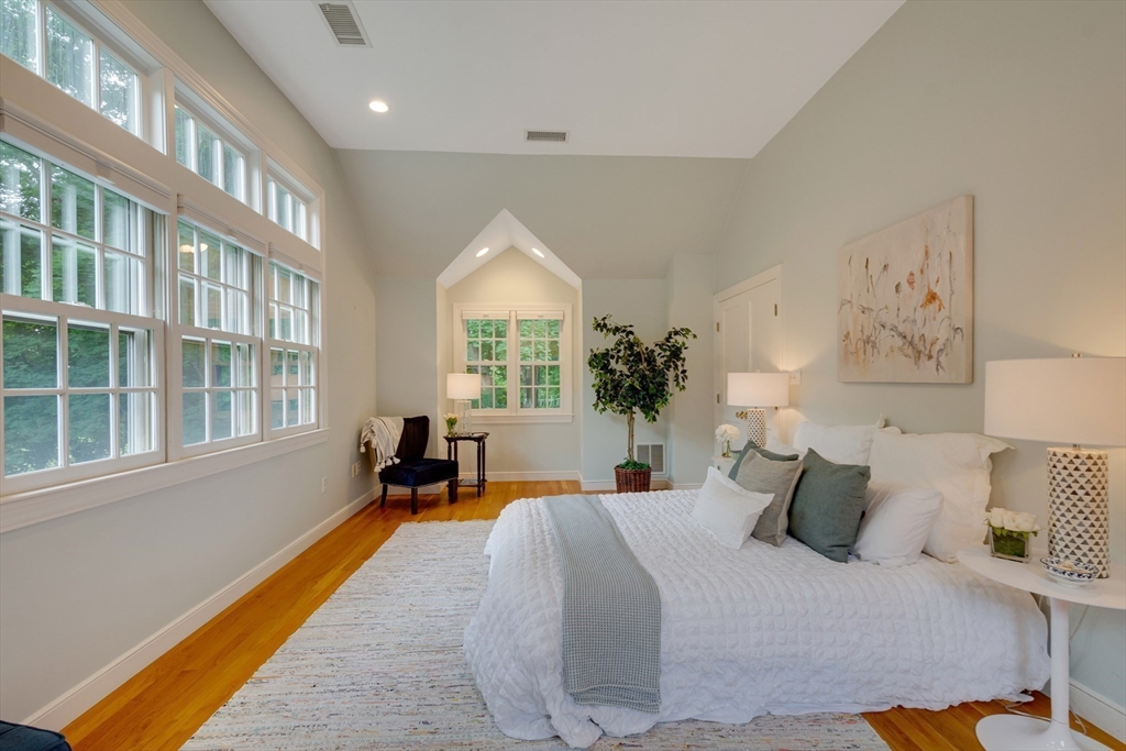 24 Beaver Pond Road Lincoln, MA 01773 - Photo 18 of 35 a bedroom with furniture and a large window