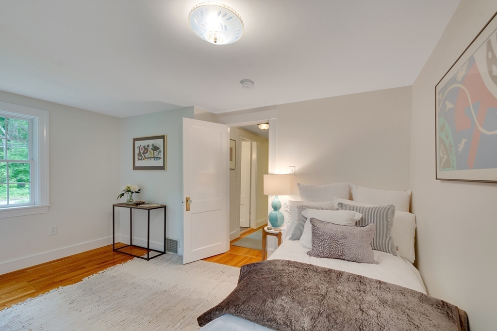 24 Beaver Pond Road Lincoln, MA 01773 - Photo 20 of 35 a bedroom with furniture and a window
