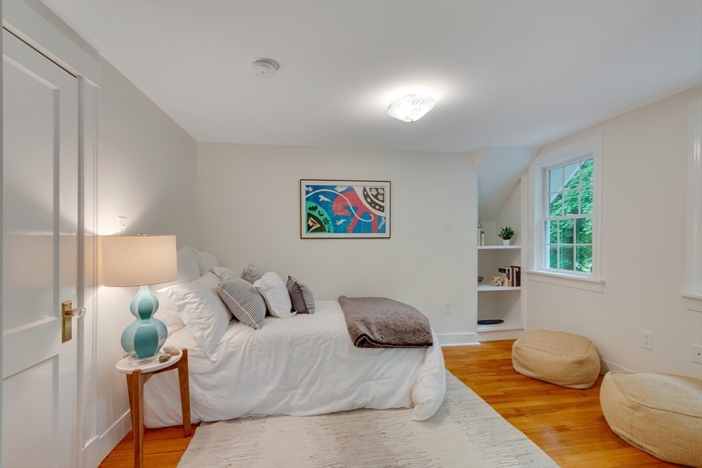 24 Beaver Pond Road Lincoln, MA 01773 - Photo 21 of 35 a bedroom with a bed and a couch