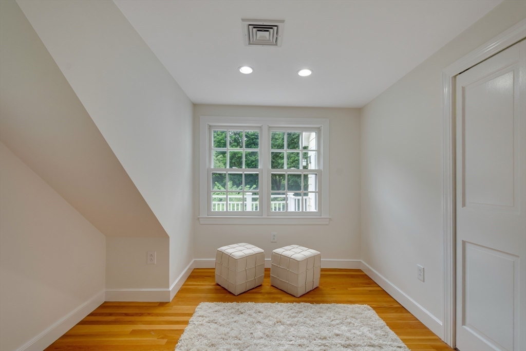 24 Beaver Pond Road Lincoln, MA 01773 - Photo 23 of 35 a living room with furniture and a rug