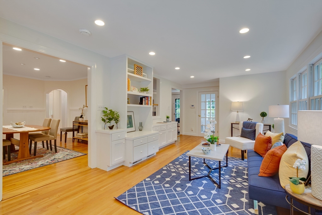 24 Beaver Pond Road Lincoln, MA 01773 - Photo 3 of 35 a living room with furniture a dining table and a dining table with wooden floor