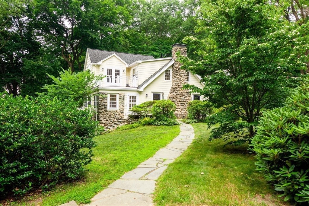 24 Beaver Pond Road Lincoln, MA 01773 - Photo 35 of 35 a view of a white house with a big yard plants and large trees