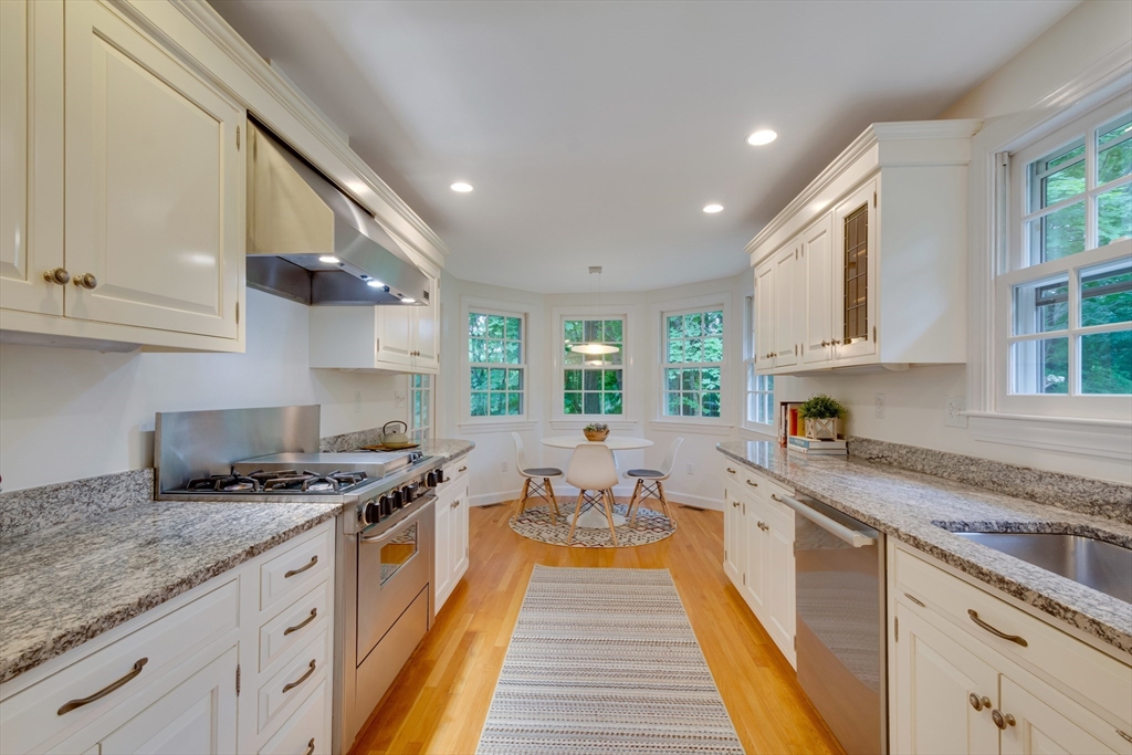 24 Beaver Pond Road Lincoln, MA 01773 - Photo 5 of 35 a kitchen with stainless steel appliances granite countertop a stove a sink and a granite counter tops
