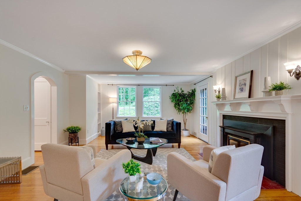 24 Beaver Pond Road Lincoln, MA 01773 - Photo 6 of 35 a living room with furniture fireplace and a large window
