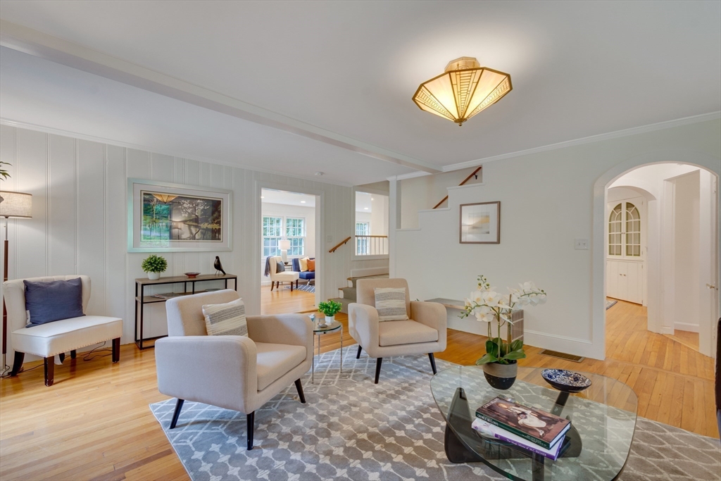 24 Beaver Pond Road Lincoln, MA 01773 - Photo 8 of 35 a living room with furniture a rug and a lamp