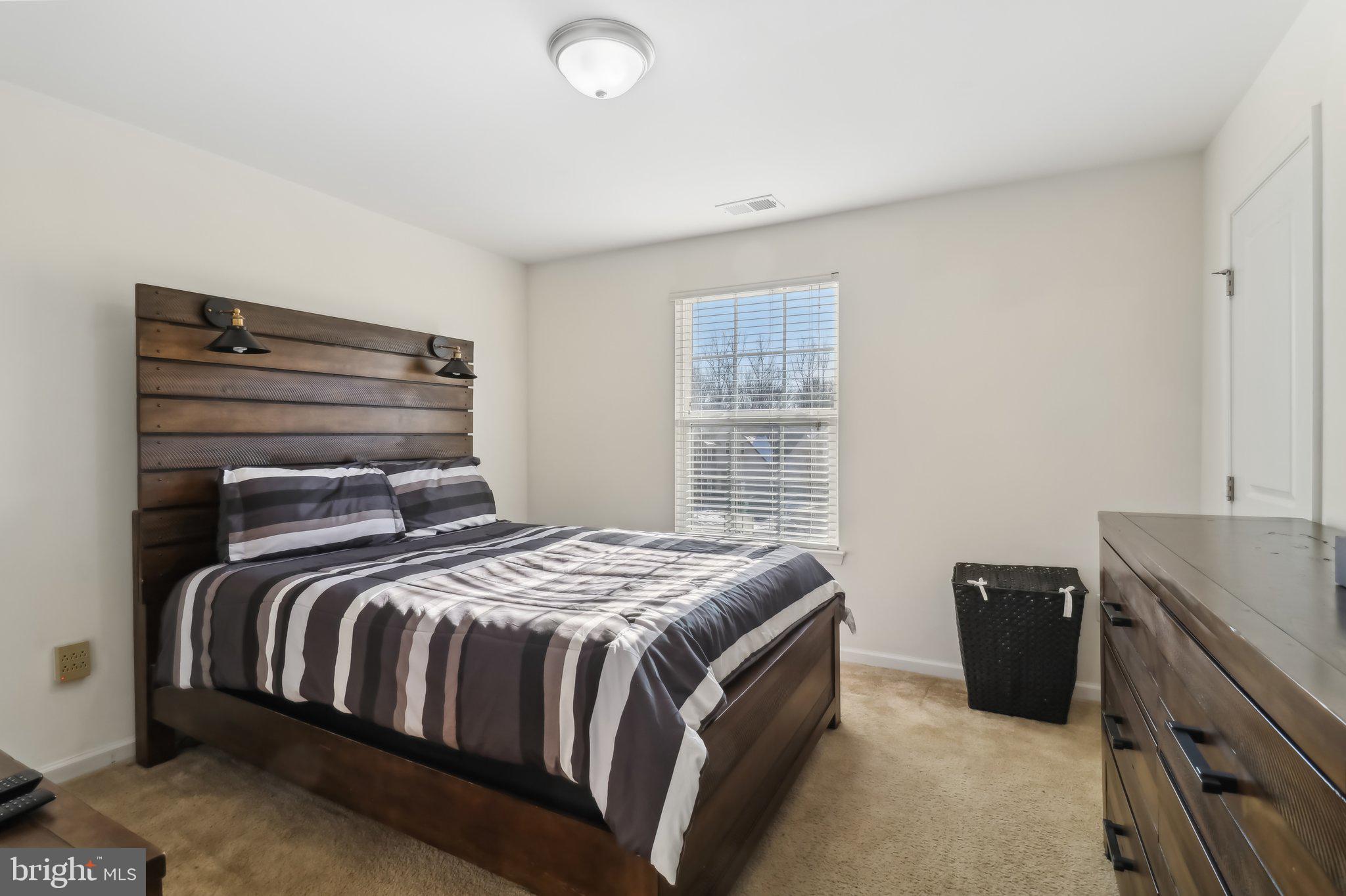 14013 Wheel Wright Place Accokeek, MD 20607 - Photo 18 of 38 a bedroom with a bed and a television