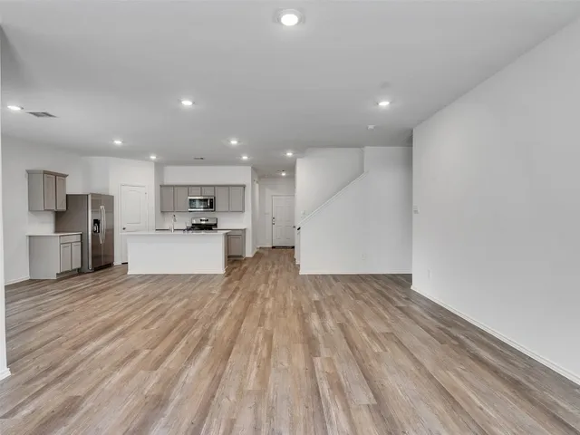 a view of kitchen with wooden floor and window