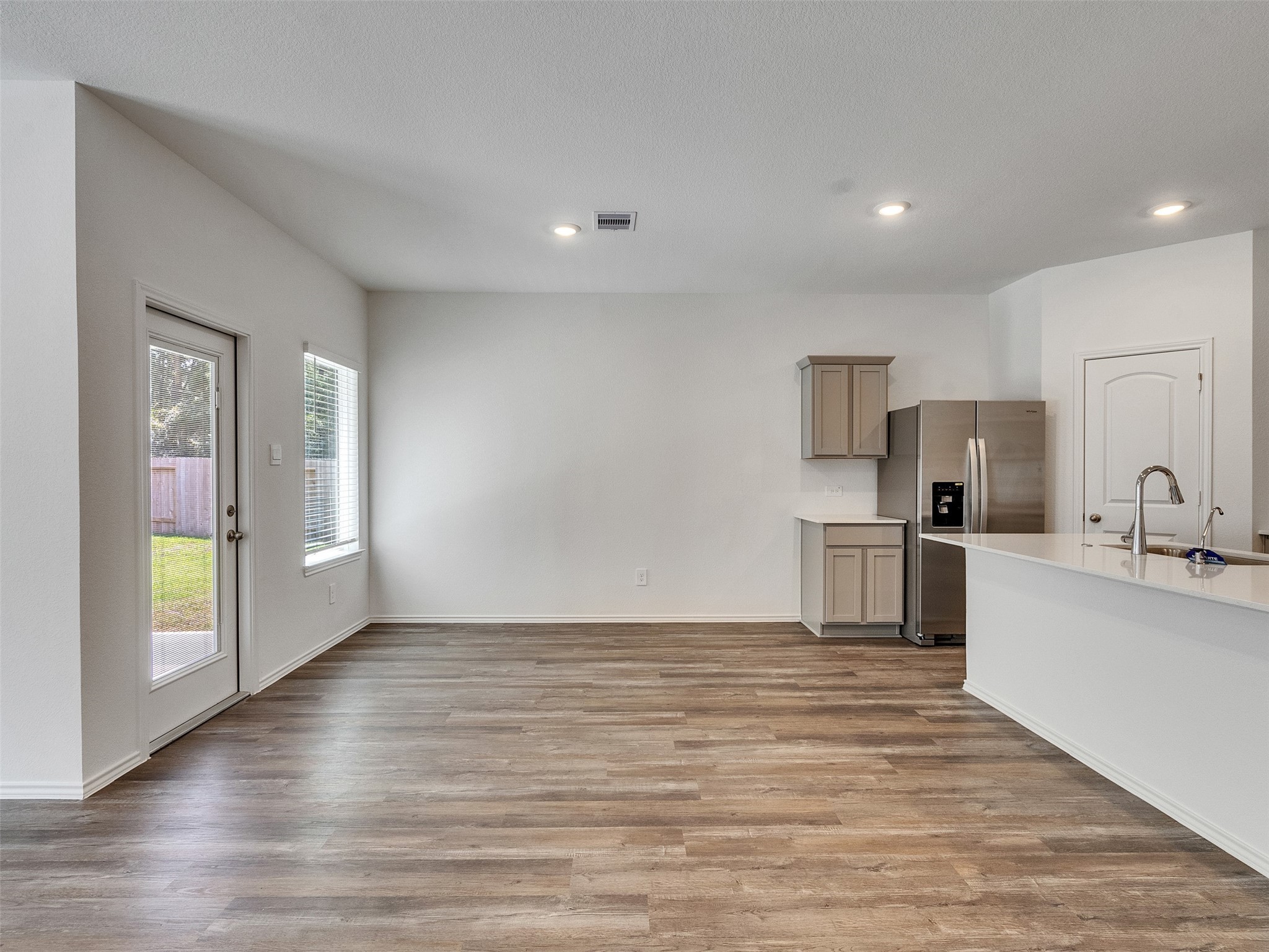 24863 Springbluff Valley Magnolia, TX 77355 - Photo 9 of 25 a kitchen with stainless steel appliances a refrigerator and a stove top oven