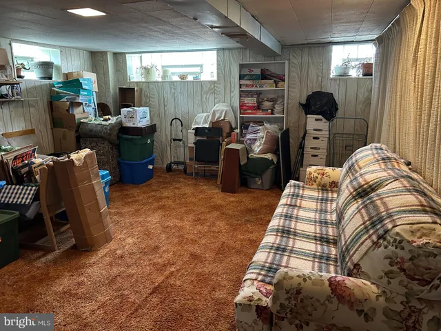 a bedroom with furniture and a flat screen tv