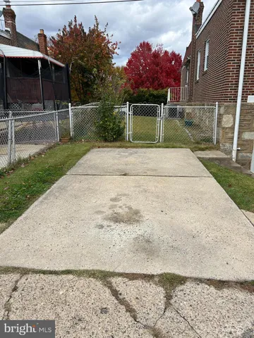 a house view with a backyard space