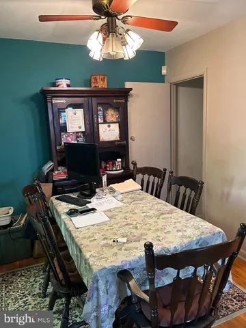 a view of a dining table and chairs in a room