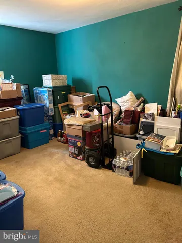 a bedroom with furniture and a flat screen tv